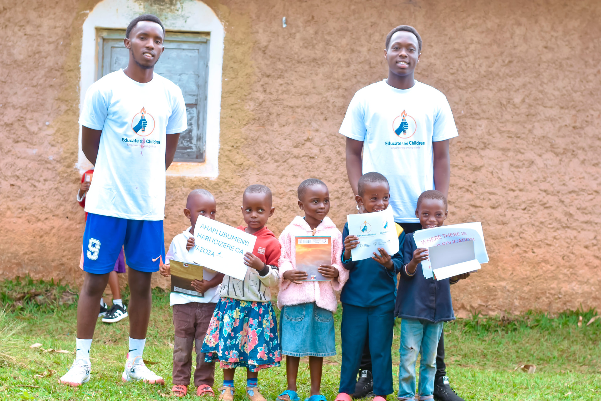 A volunteer speaking with pupils during a classroom visit in Burundi.